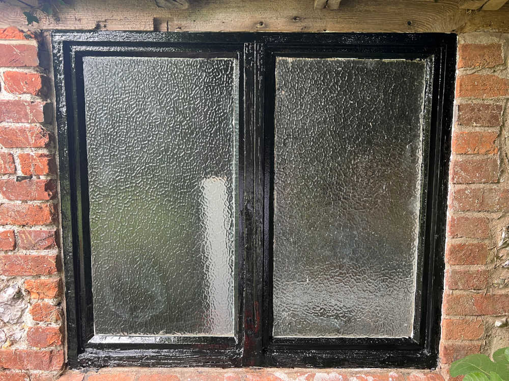 Window frame repaired and painted
