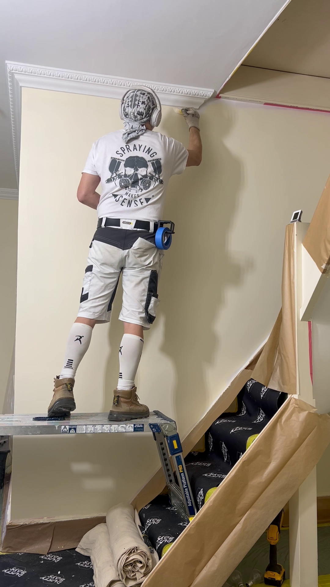 Interior painter decorating a staircase in West Sussex